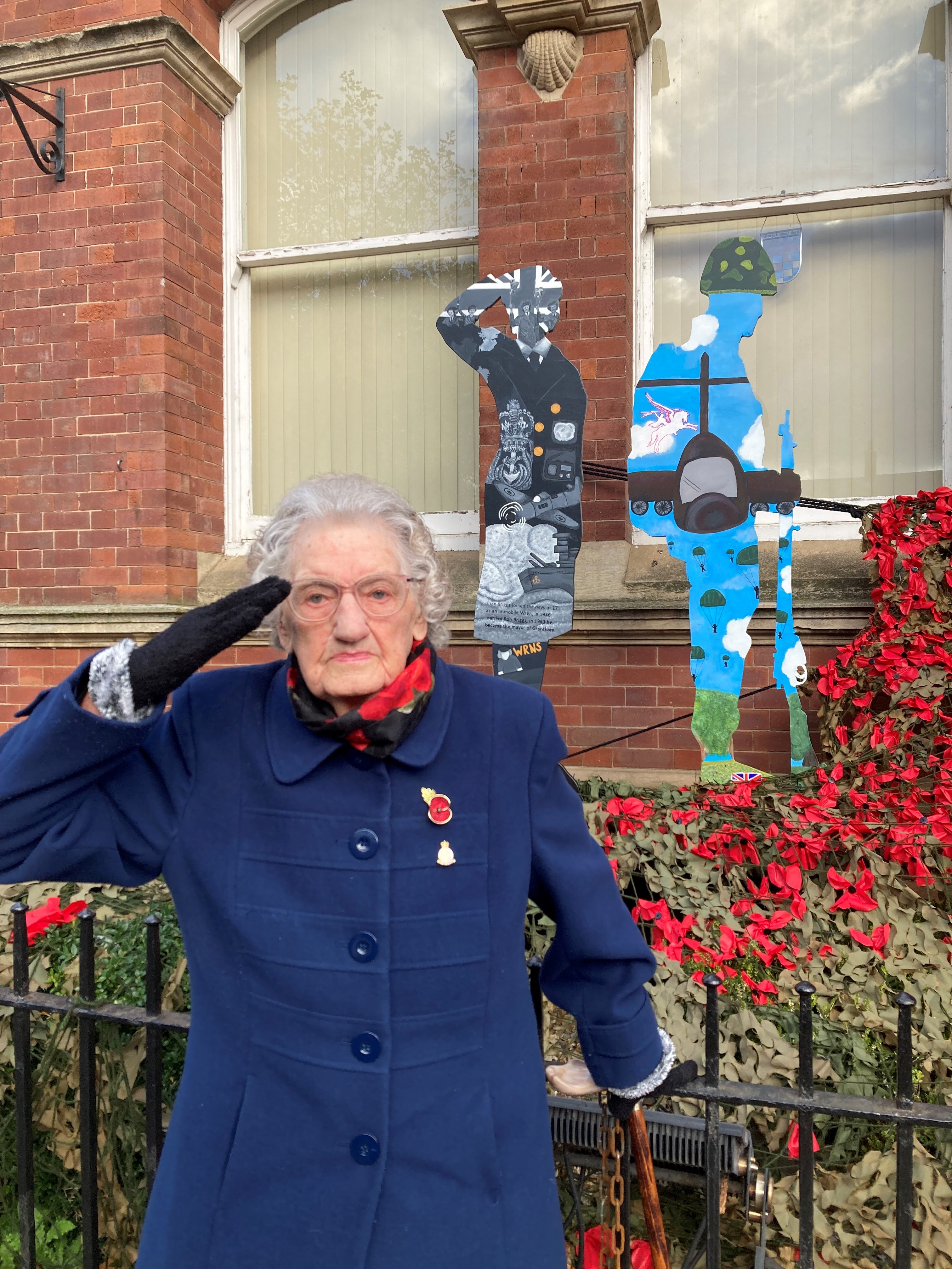 WW2 Navy veteran Joan Briggs with a Remembrance salute.