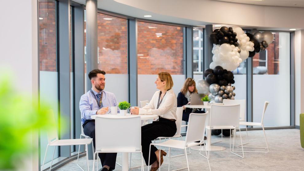 Office photograph of SKDC with people sat at breakout areas