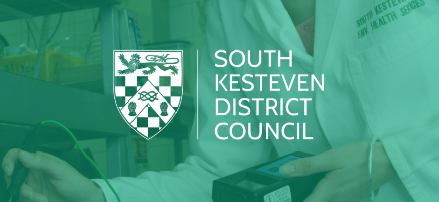 Environmental Health Officer taking meat temperature. Green screen overlaid. South Kesteven District Council logo in centre. 