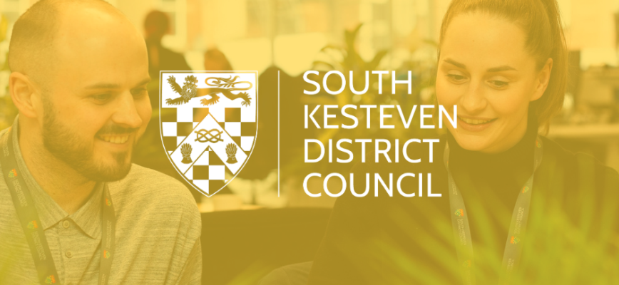 A photograph of two SKDC employees. Yellow screen overlaid. South Kesteven District Council logo in the centre. 