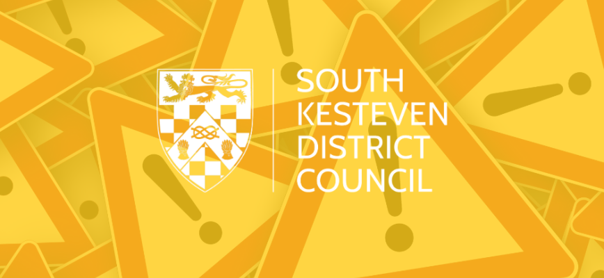 Warning signs with a yellow overlaid screen. South Kesteven District Council logo in the centre. 